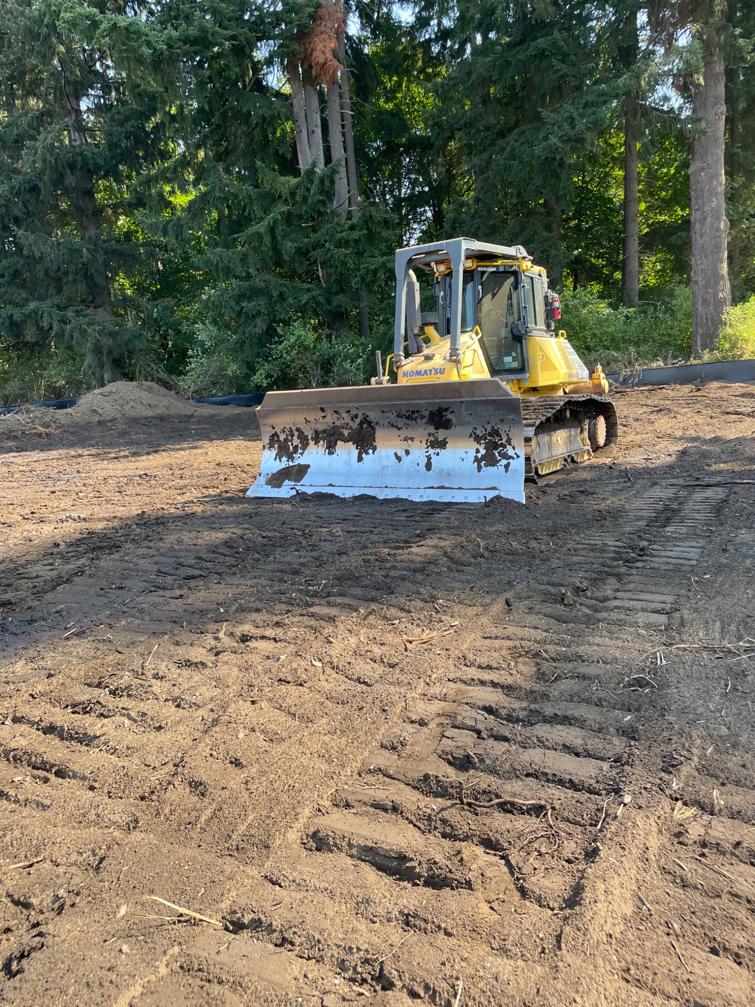 Dozer grading a prepared site